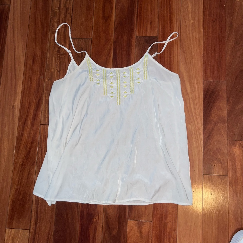 loose white shirt with green detailing